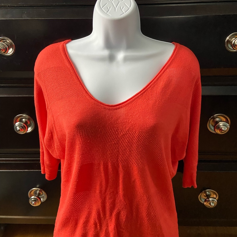 Express mango-colored 3/4 sleeve v neck shirt.